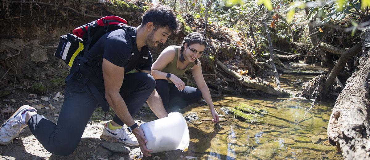 students collecting samples from river