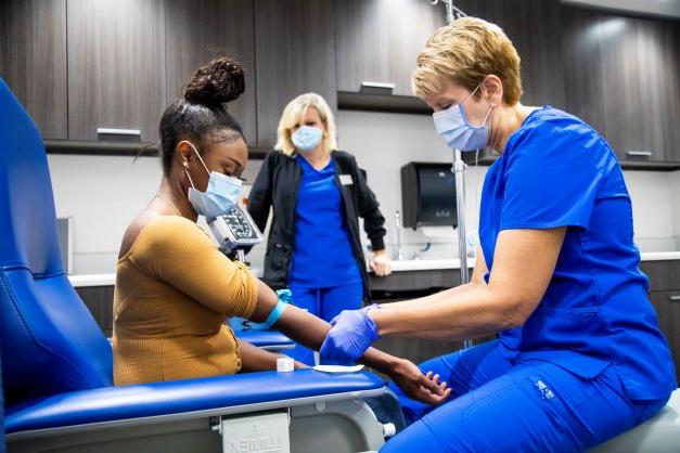 Student getting a shot in the Health Center