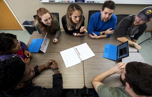 Computer science students working together.