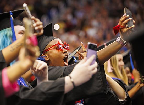 Graduates celebrating at 博彩平台推荐's spring commencement